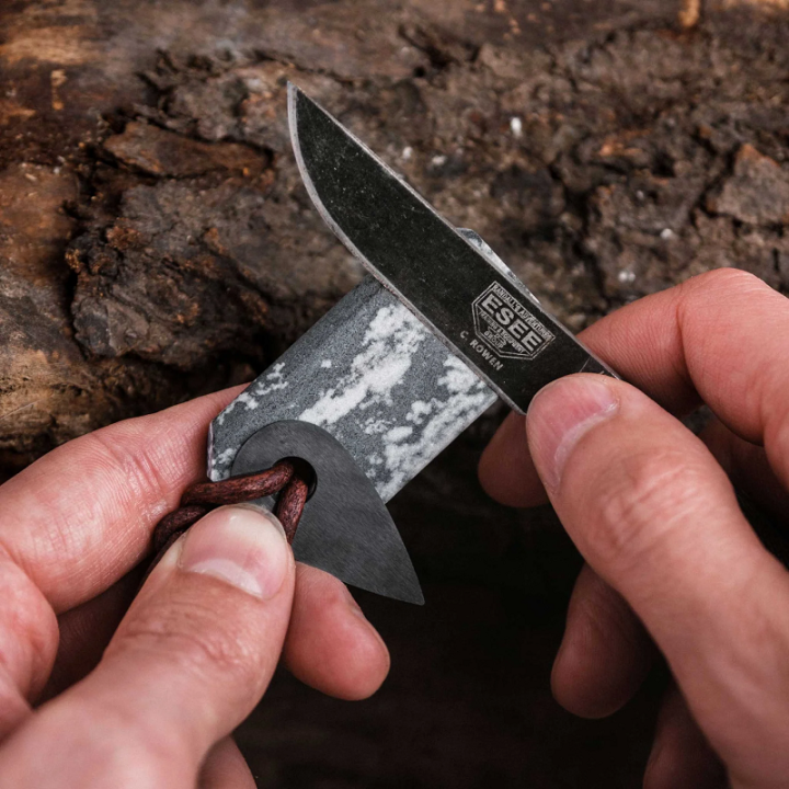 Wazoo Viking Spark Necklace being used on a blade