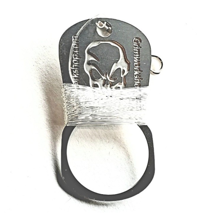 Grim Workshop - Hand Caster Dog Tag with fishing line white background